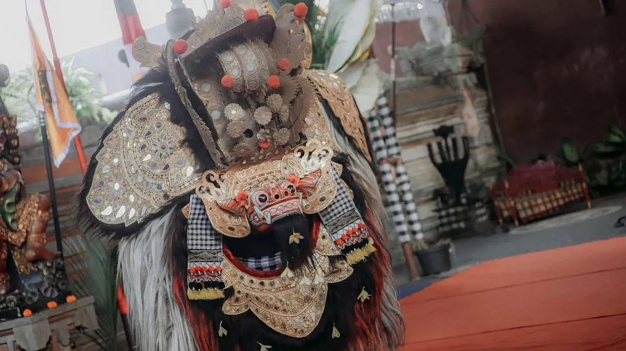 Ilustrasi mimpi abimanyu — A performer in a traditional balinese barong costume
