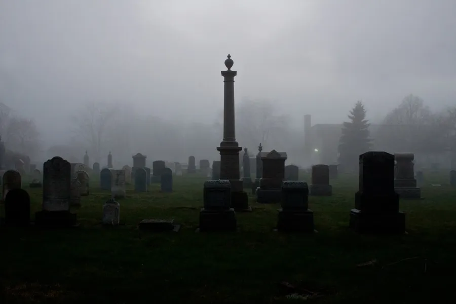 Ilustrasi mimpi kuburan — black and gray cement tombs