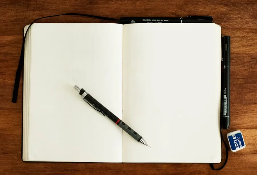 Ilustrasi mimpi penyair — black and silver retractable pen on blank book