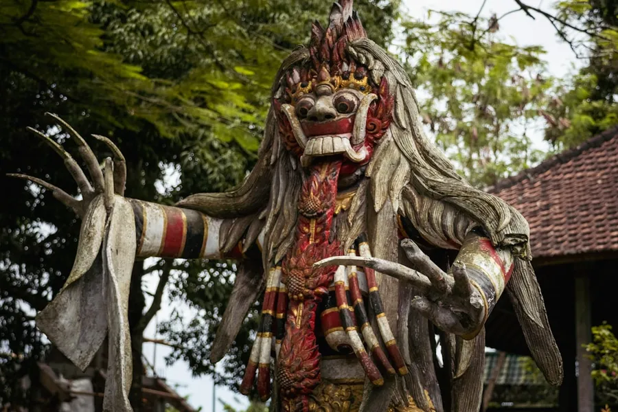 Ilustrasi mimpi ratih & kamajaya — A statue of a demon with horns and horns