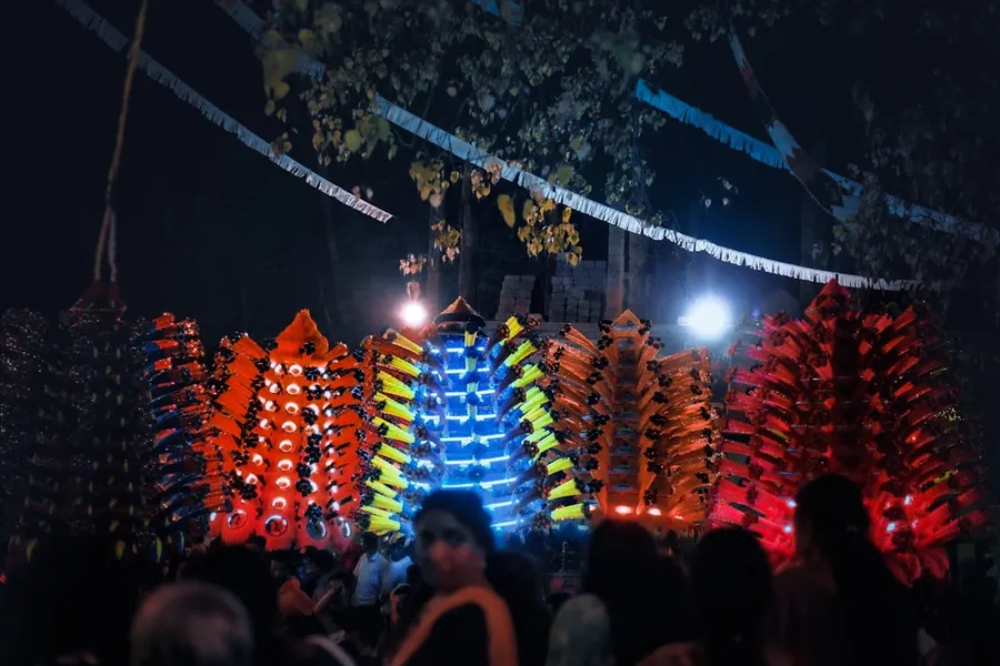 Ilustrasi mimpi srikandi — a group of people standing in front of a colorful display