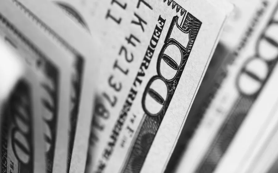 Ilustrasi mimpi uang perak — closeup photo of 100 US dollar banknotes